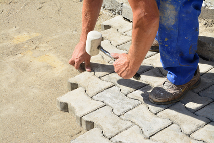 Showing how to install interlocking paving stones